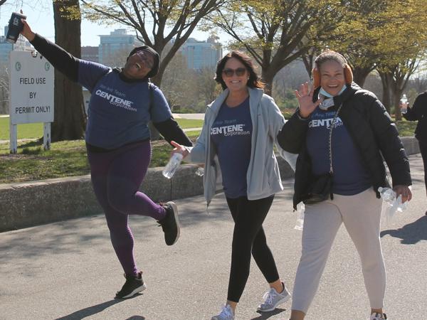a group of women running on a road