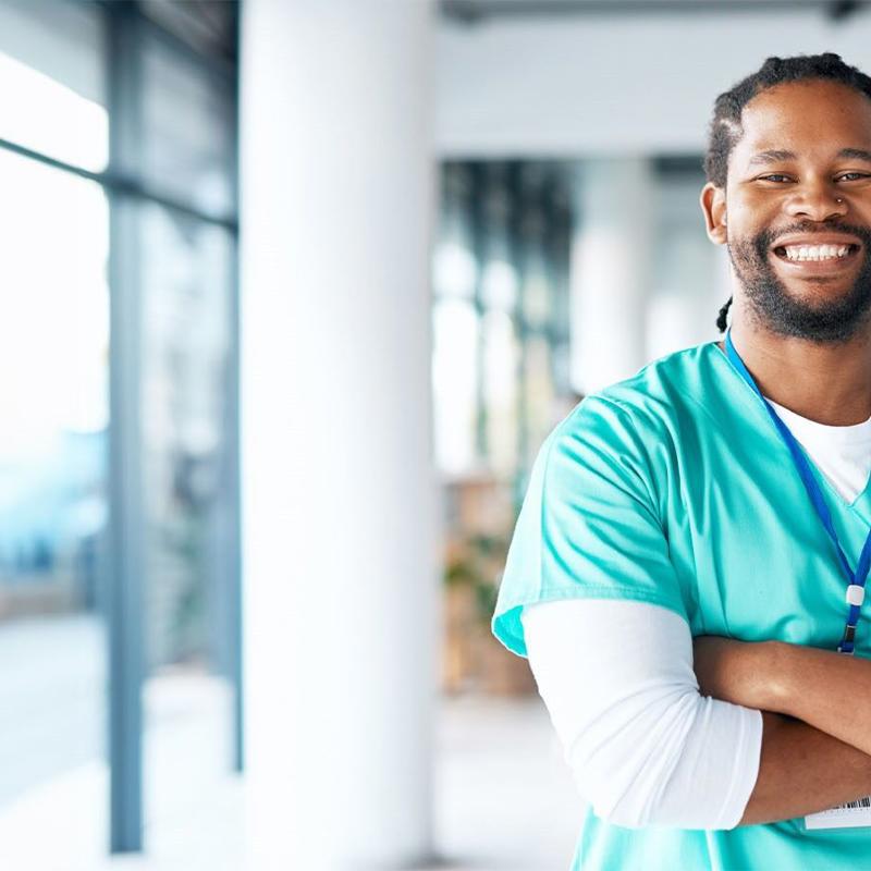 a person in scrubs smiling