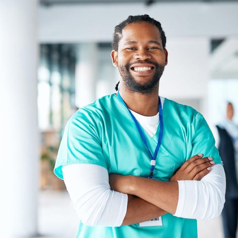 a person in scrubs smiling