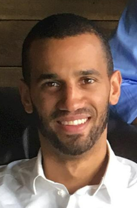 a man smiling at the camera