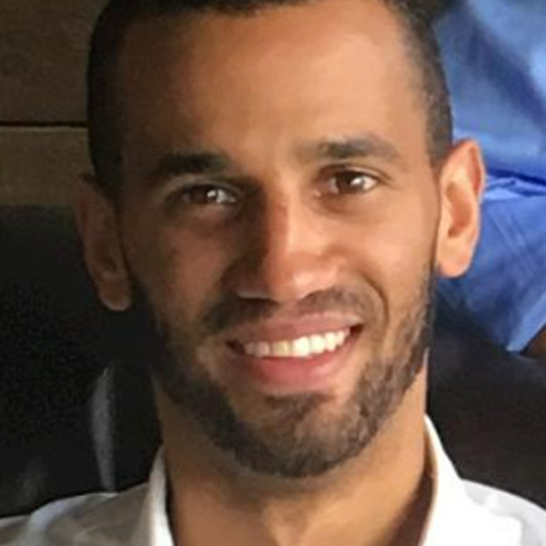 a man smiling at the camera