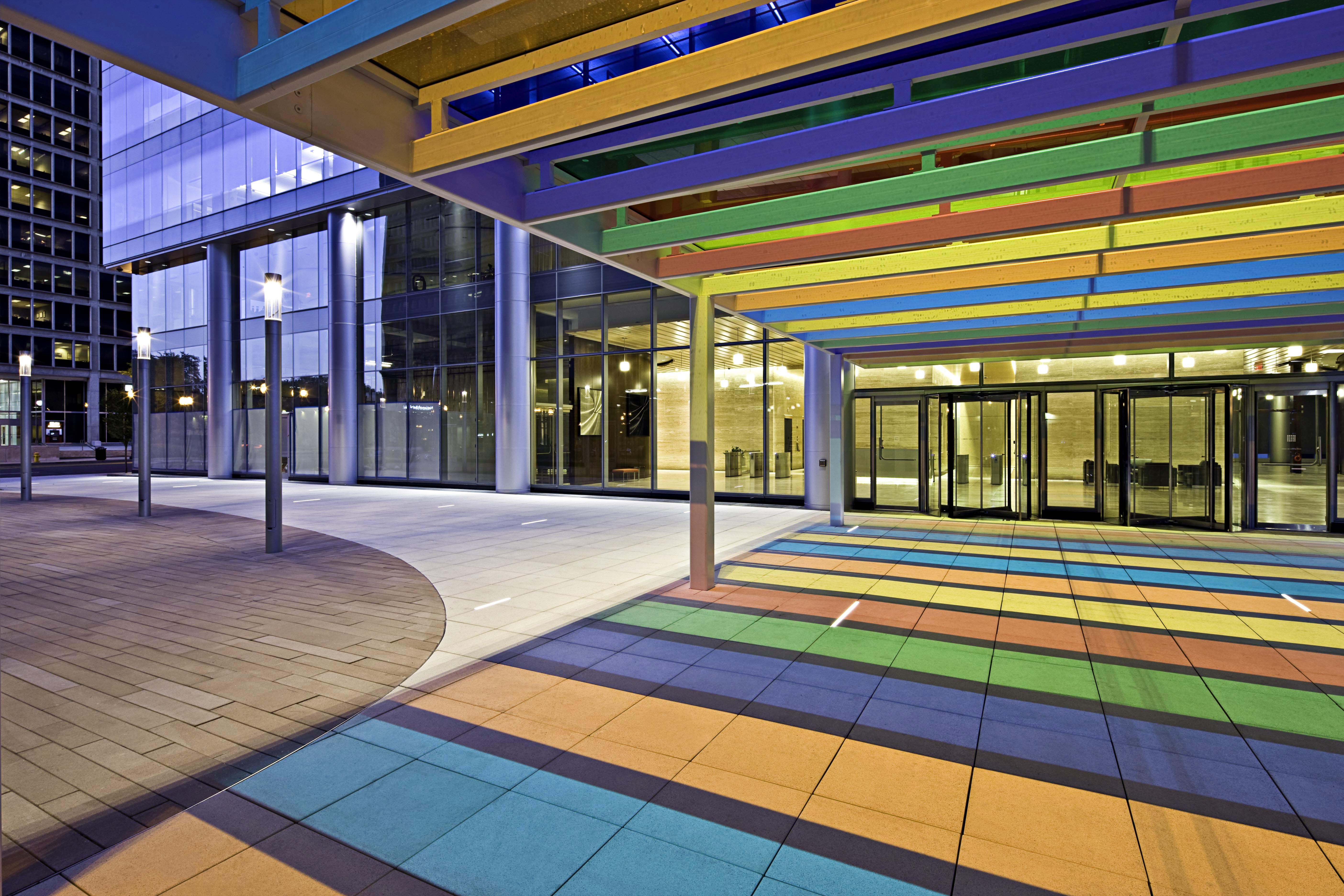a colorful walkway with glass doors