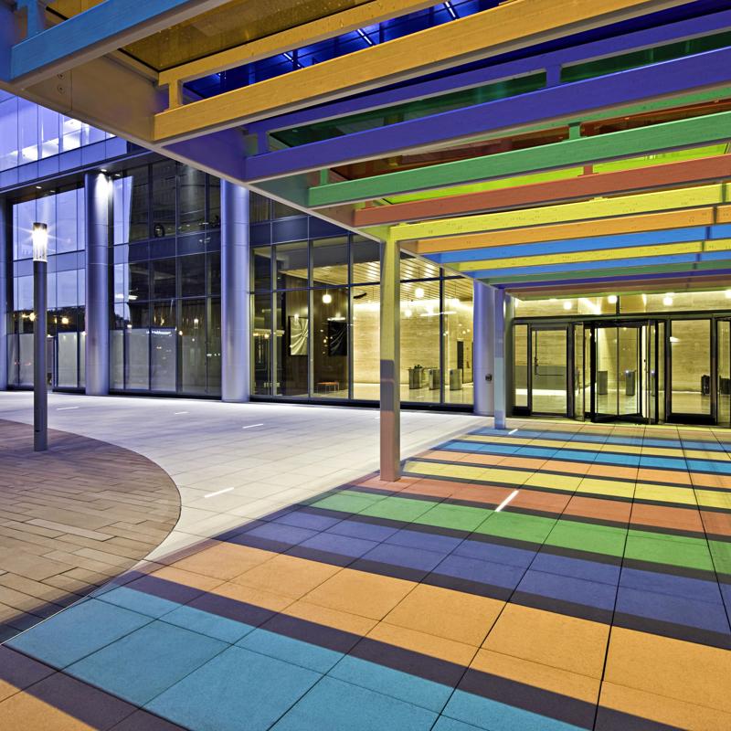 a colorful walkway with glass doors