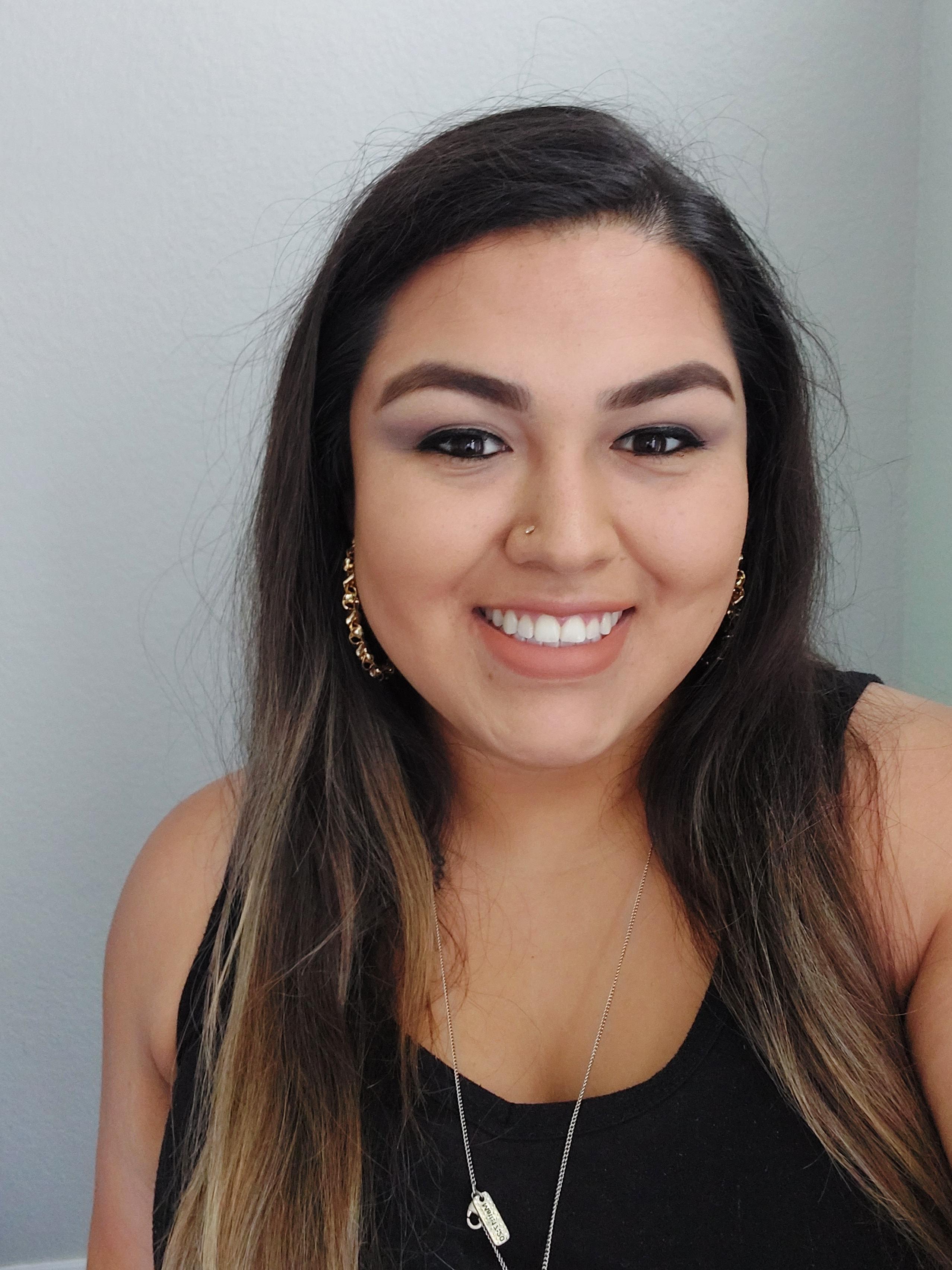 a woman smiling for a selfie
