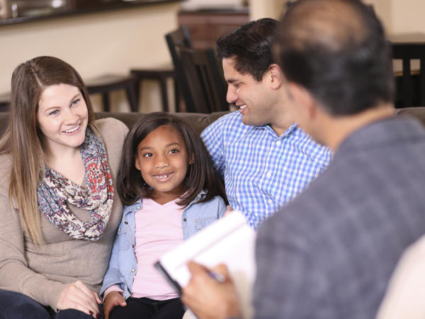 a group of people sitting on a couch