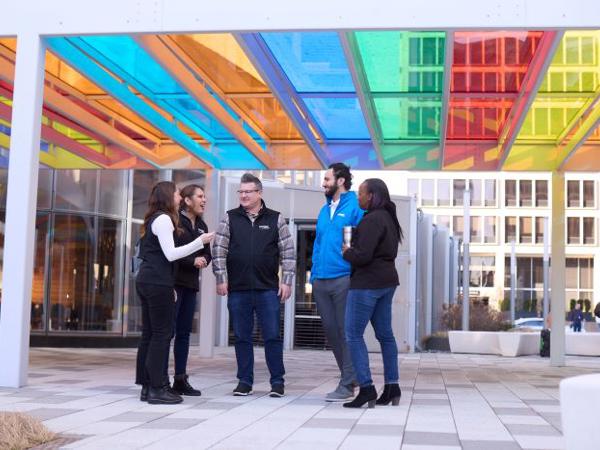 a group of people standing outside a building