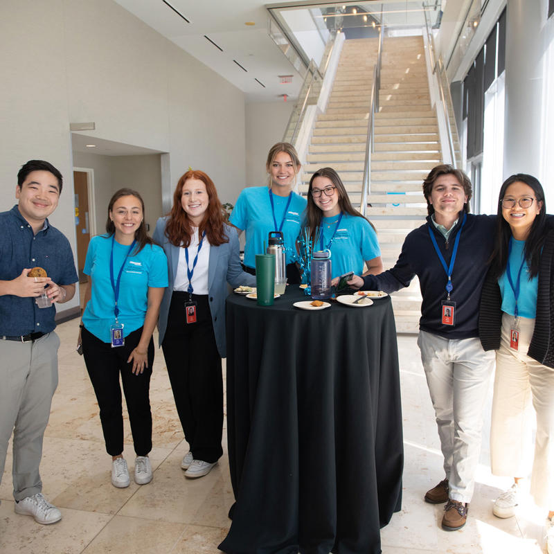 Centene interns gather around a table.
