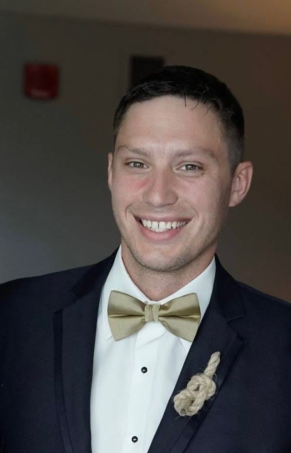 a person in a suit smiling