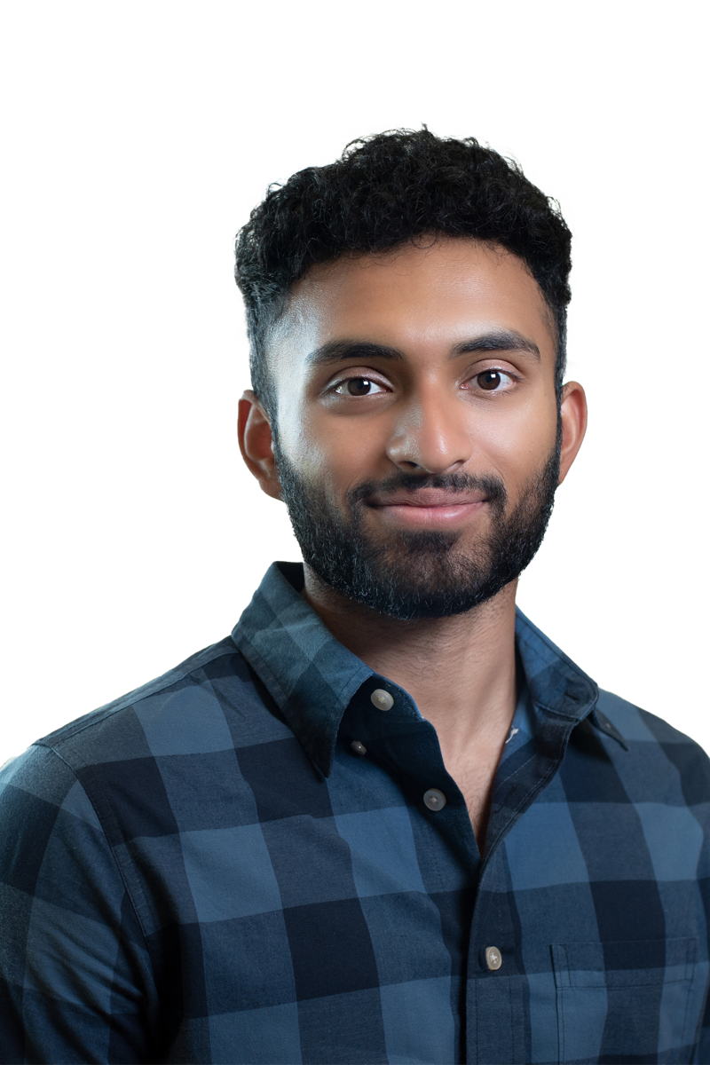 a man with a beard and mustache wearing a blue flannel shirt