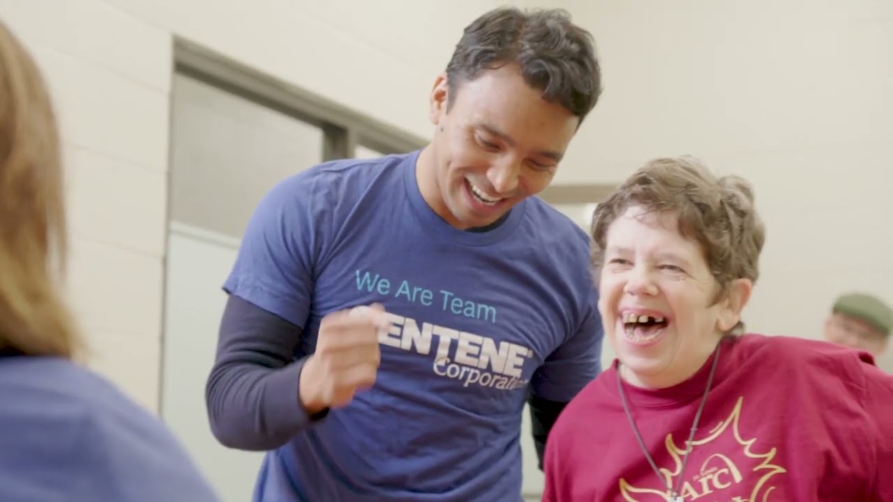 a man laughing with a child