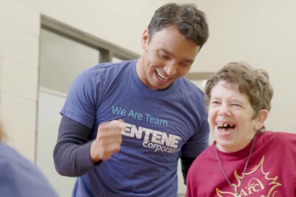 a man laughing with a child