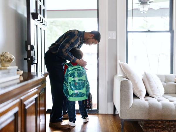 a person and child standing in a doorway