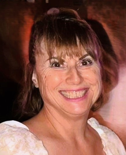 a woman smiling at camera