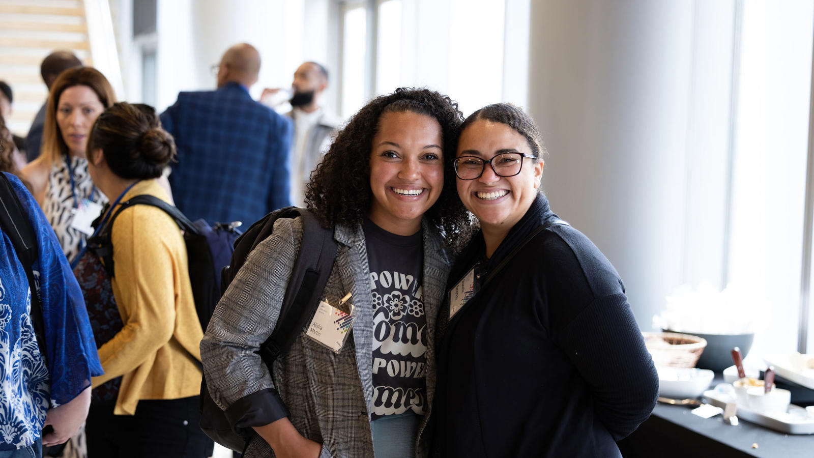 two women smiling at camera