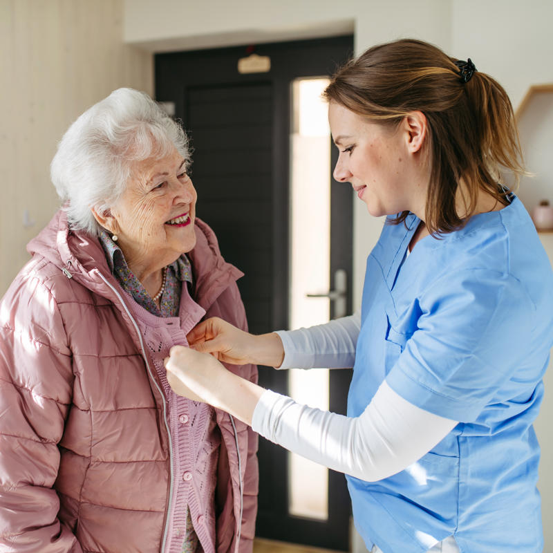 a person helping an old person