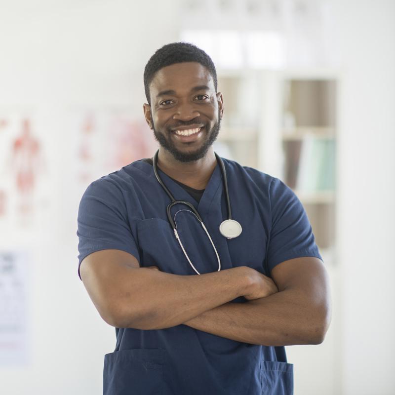 a man wearing scrubs and stethoscope
