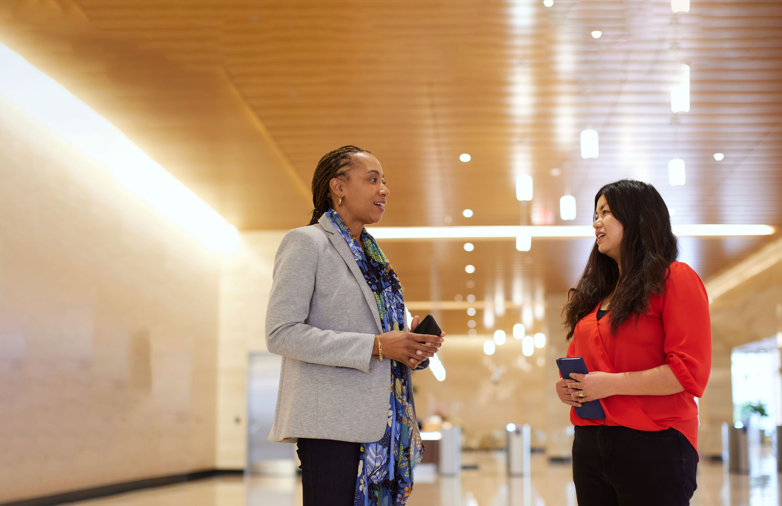 a woman talking to another woman