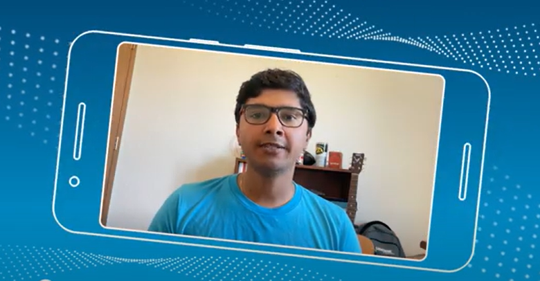 a man wearing glasses and a blue shirt