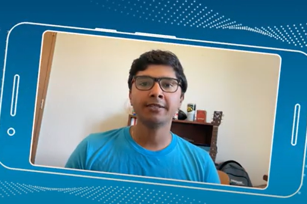 a man wearing glasses and a blue shirt